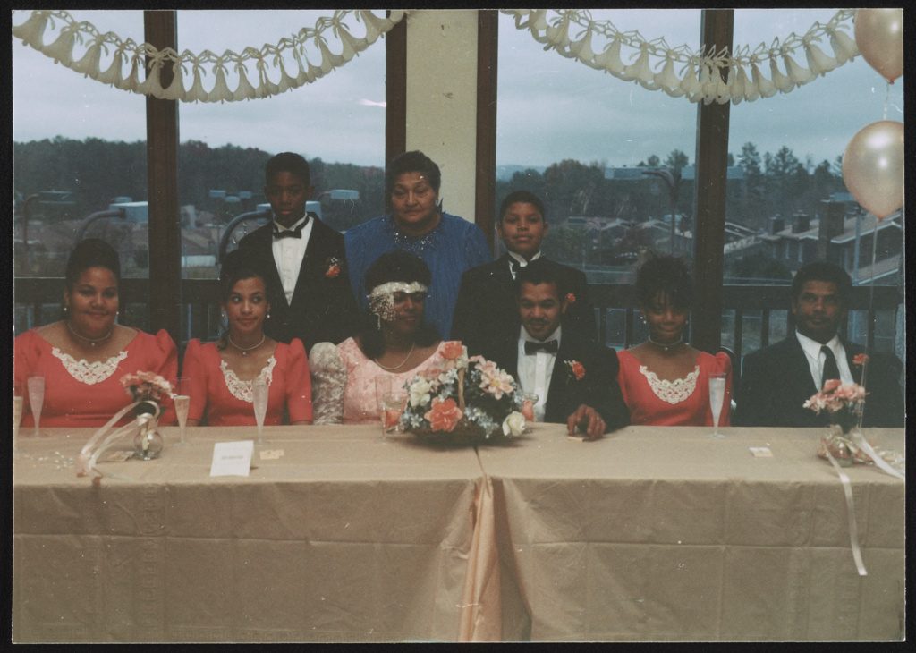 A wedding party seated at a long table